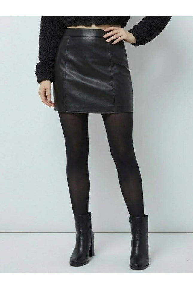 Person wearing a black leather skirt, black tights, and black boots on a white background