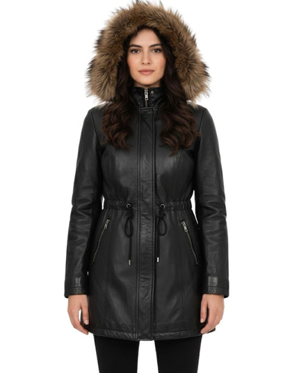 Woman wearing a black leather jacket with a fur-lined hood on a white background