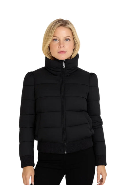 Woman wearing a black puffer jacket on a white background
