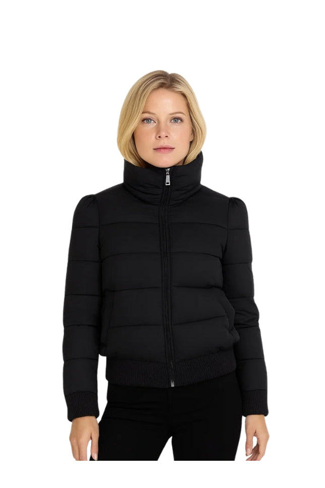 Woman wearing a black puffer jacket on a white background