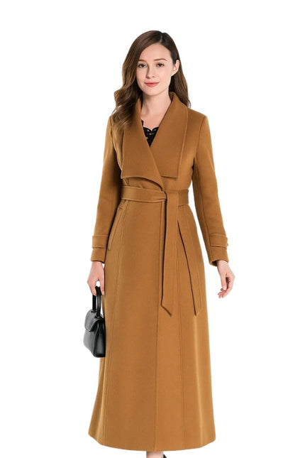 Woman wearing a long brown coat on a white background