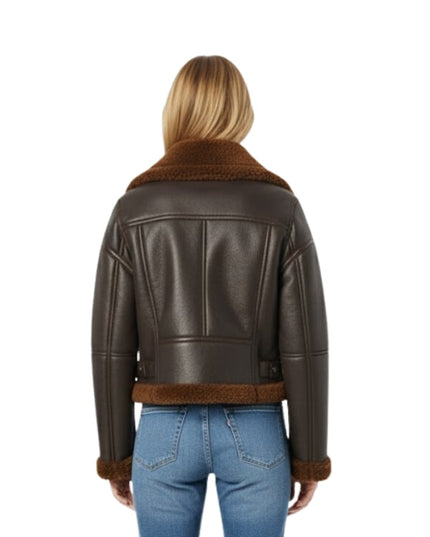 Brown leather jacket with fur trim worn by a person on a white background