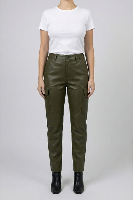 Person wearing olive green pants and a white shirt on a plain background