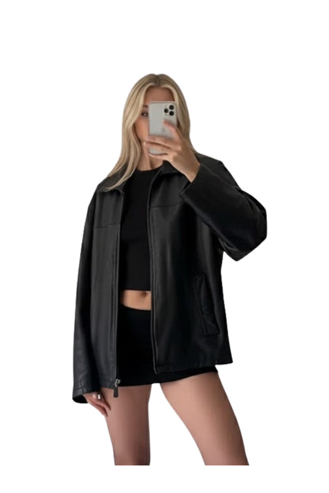 Person wearing a black leather jacket and black outfit on a white background