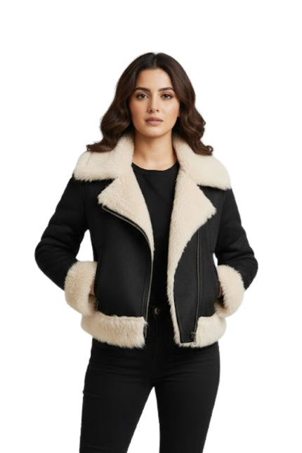 Woman wearing a black and beige shearling jacket on a white background