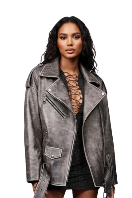 Woman wearing a gray suede jacket on a white background