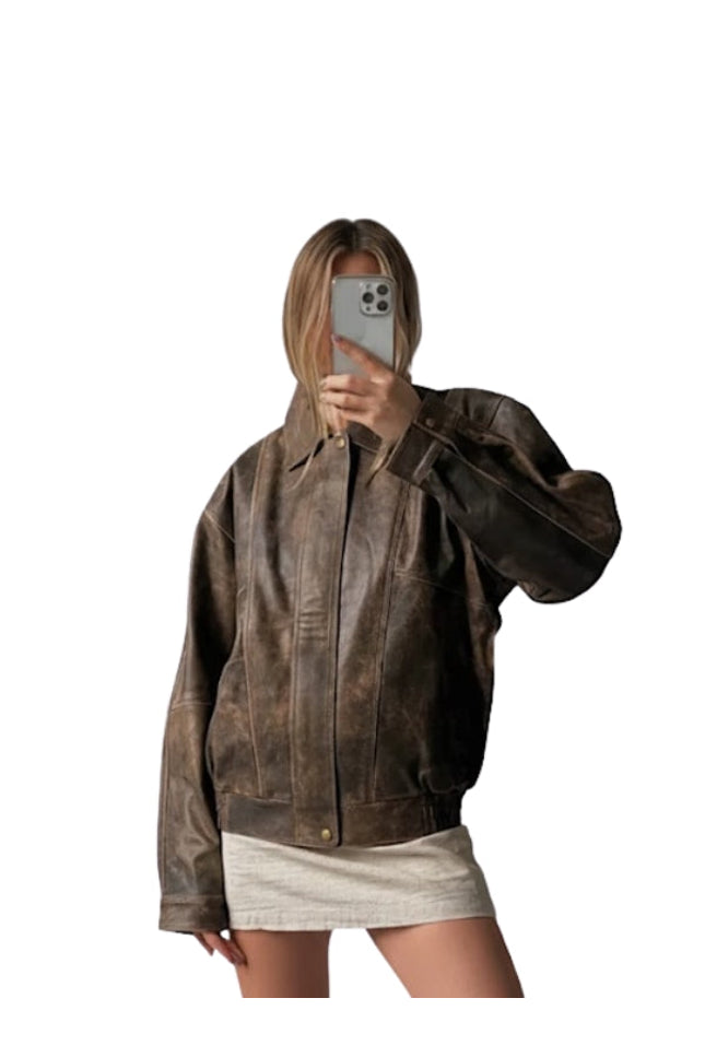 Person wearing a brown leather jacket on a white background