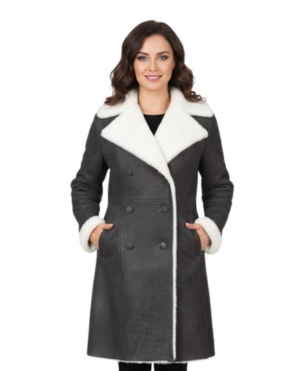 Woman wearing a gray coat with white fur trim on a white background