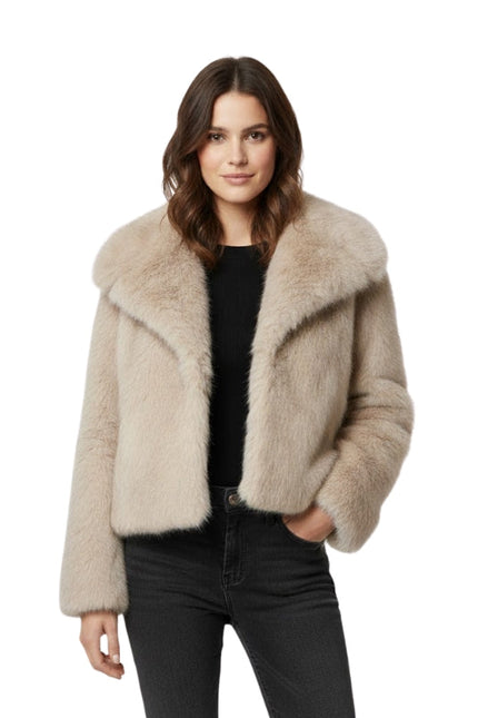 Woman wearing a beige fur jacket on a white background
