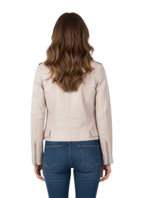 Woman wearing a beige leather jacket and blue jeans on a white background