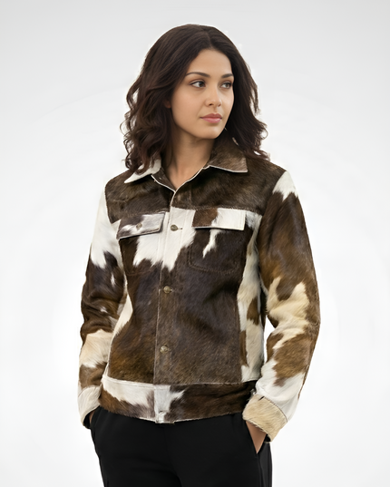 Woman wearing a brown and white cowhide jacket on a white background