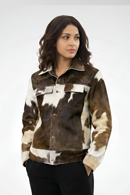 Woman wearing a brown and white cowhide jacket on a white background