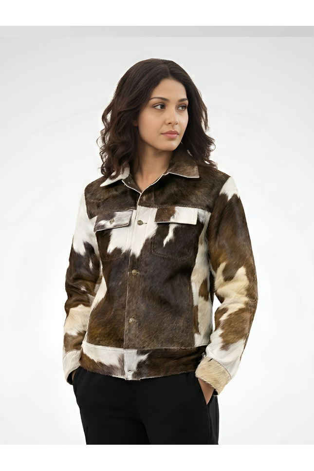 Woman wearing a brown and white cowhide jacket on a white background