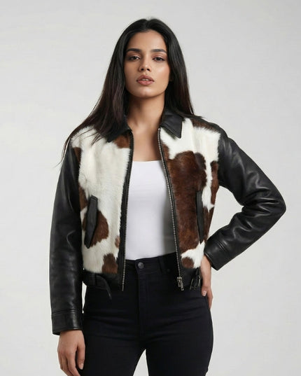 Woman wearing a black leather jacket with cowhide pattern on a white background