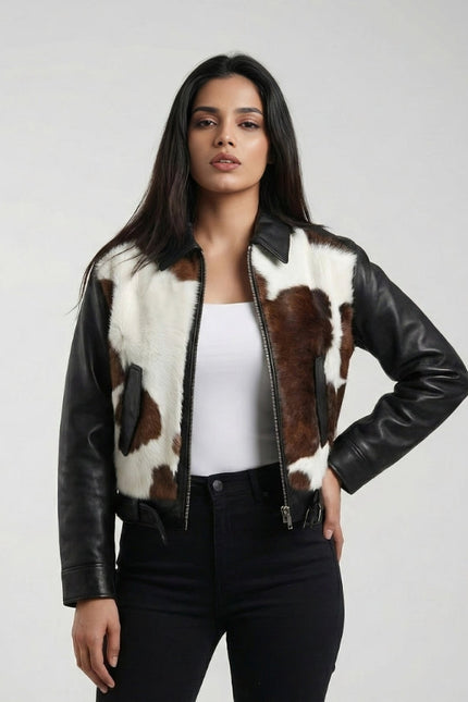 Woman wearing a black leather jacket with cowhide pattern on a white background