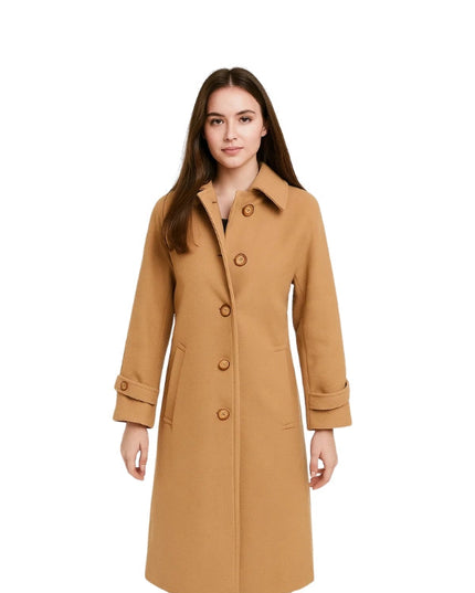Woman wearing a tan coat on a white background