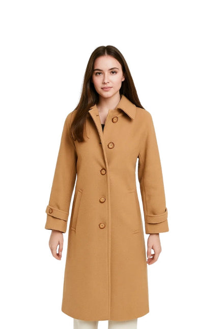 Woman wearing a tan coat on a white background