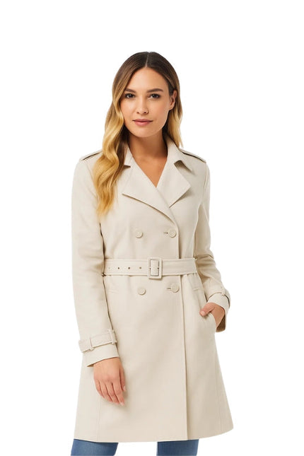 Woman wearing a beige trench coat on a white background