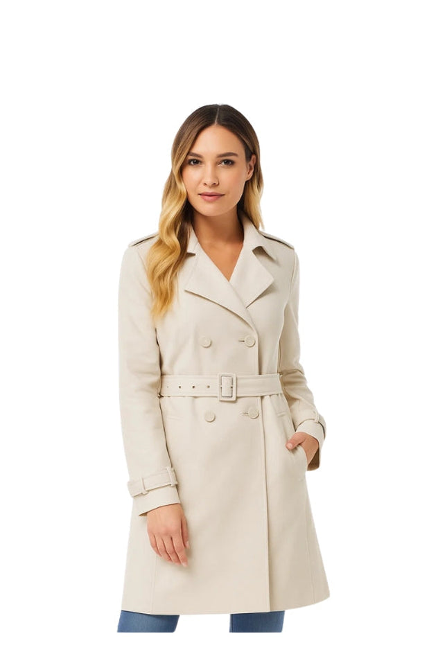 Woman wearing a beige trench coat on a white background