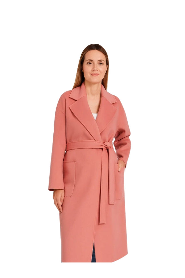 Woman wearing a pink coat on a white background
