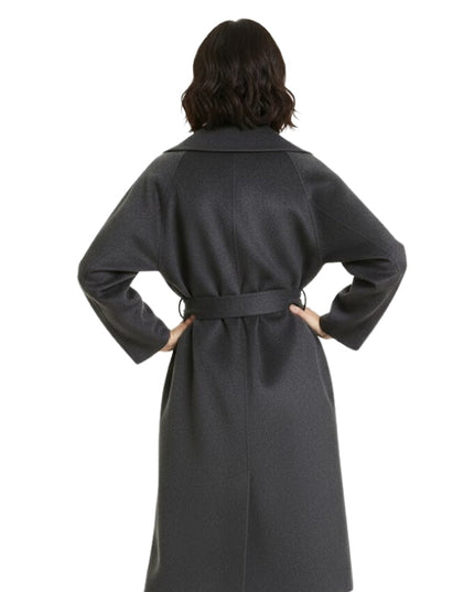 Person wearing a gray coat with a belt on a white background