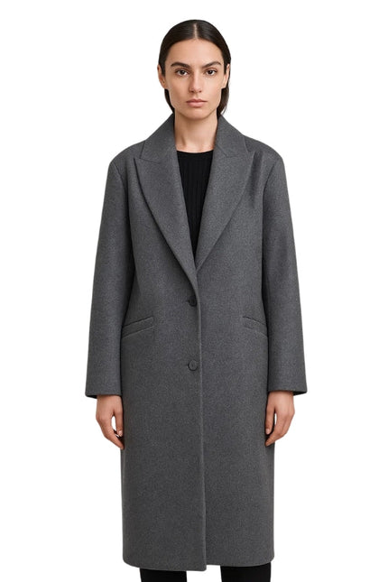 Woman wearing a gray coat on a white background