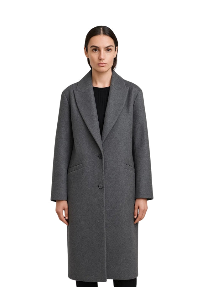 Woman wearing a gray coat on a white background