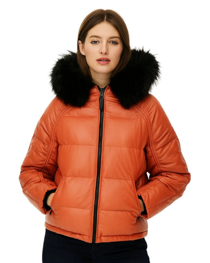 Orange puffer jacket with black fur hood worn by a model on a white background