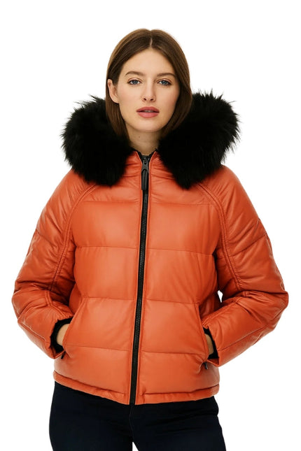 Orange puffer jacket with black fur hood worn by a model on a white background
