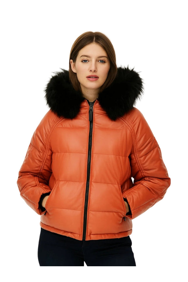 Orange puffer jacket with black fur hood worn by a model on a white background