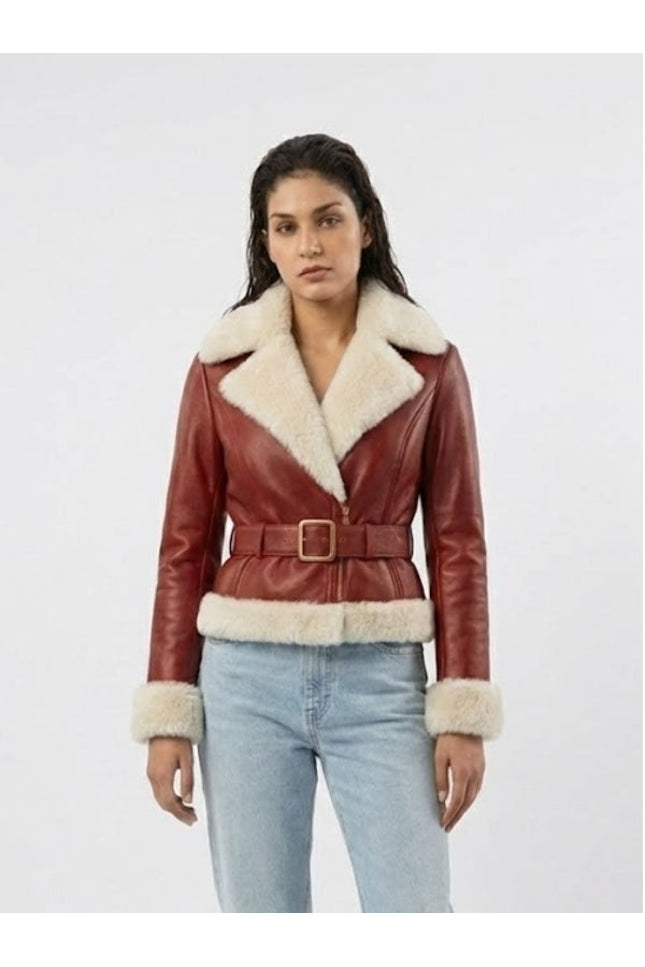 Woman wearing a red leather jacket with white fur trim on a white background