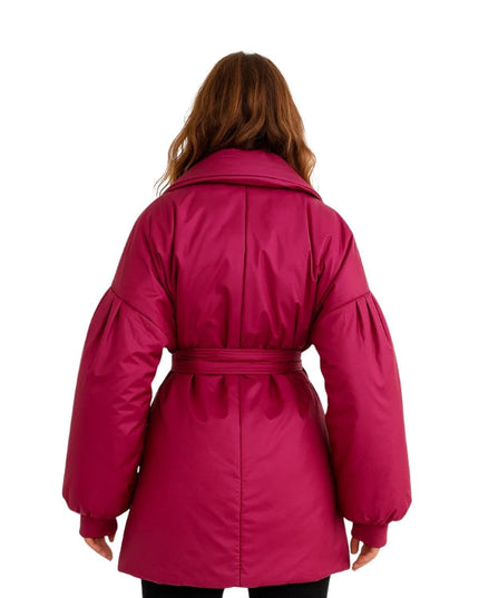 Pink coat worn by a person on a white background