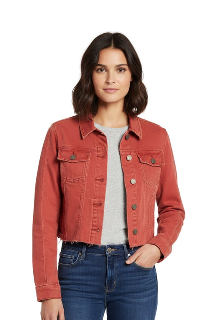 Woman wearing a red denim jacket on a white background