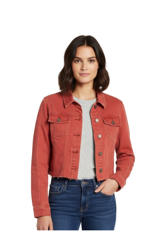 Woman wearing a red denim jacket on a white background