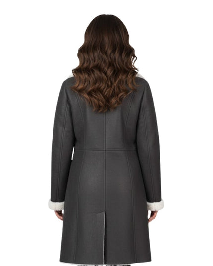 Woman wearing a gray coat with white trim on a white background