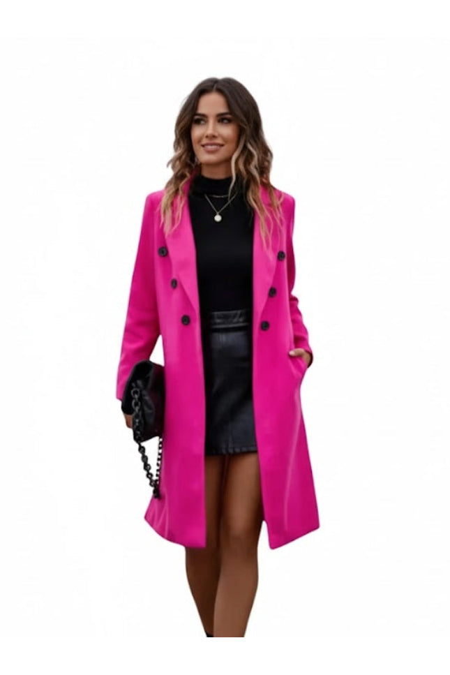 Woman wearing a bright pink coat on a white background