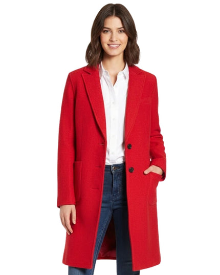 Woman wearing a red coat on a white background