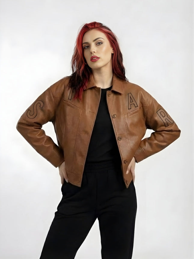 Person wearing a brown leather jacket with lettering on a white background