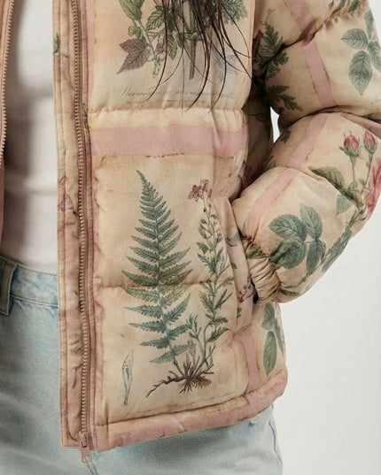 Floral and botanical patterned puffer jacket on a white background
