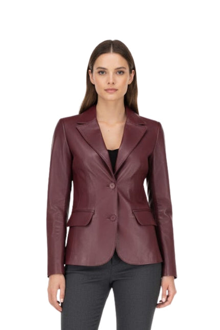 Woman wearing a burgundy leather blazer on a white background