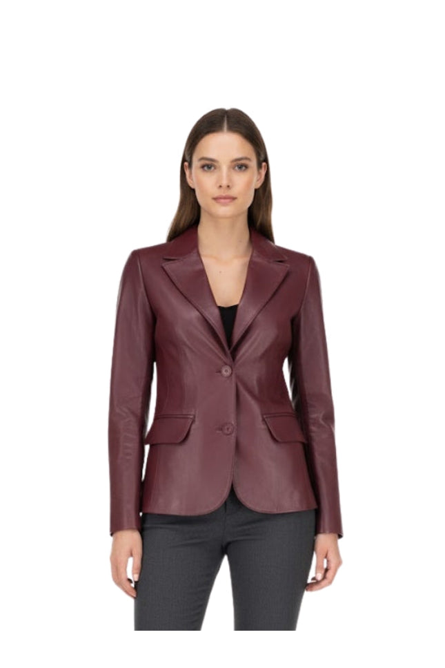 Woman wearing a burgundy leather blazer on a white background