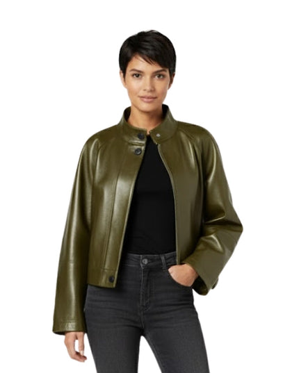 Woman wearing an olive green leather jacket on a white background
