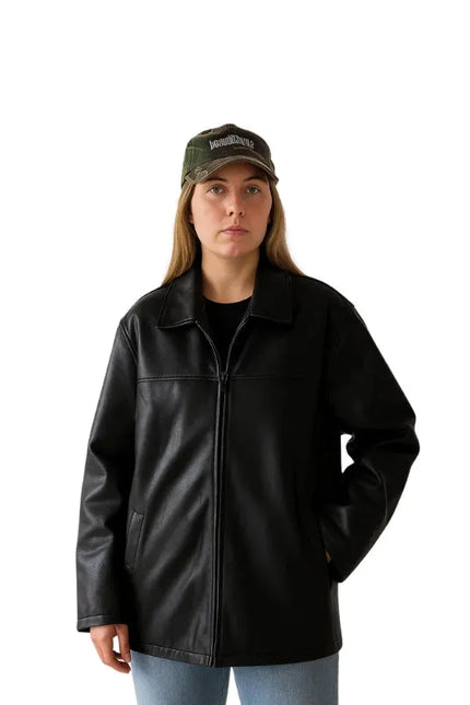 Women’s oversized black leather jacket with straight fit and classic minimalist design.