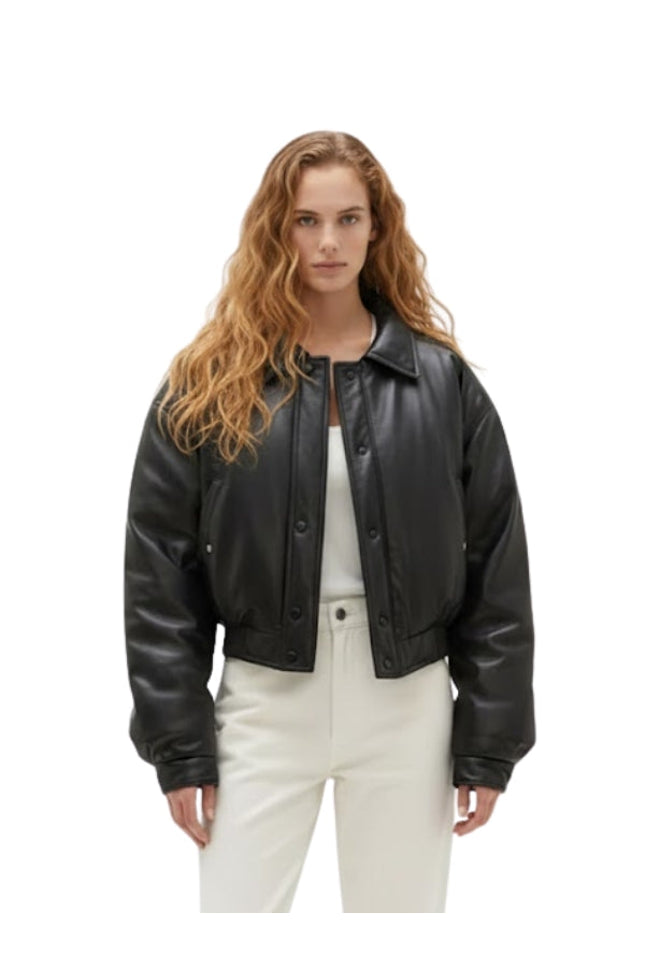 Woman wearing a black leather jacket on a white background