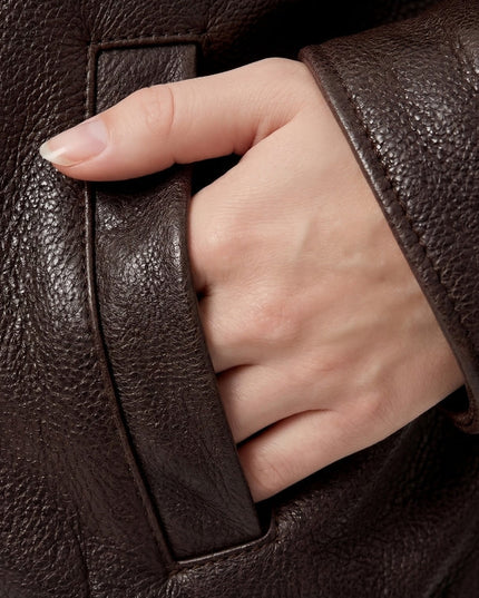 Hand inside jacket's pocket 