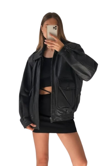 Person wearing a black leather jacket and black outfit on a white background