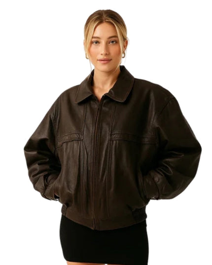 Woman wearing a brown leather jacket on a white background