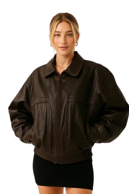 Woman wearing a brown leather jacket on a white background