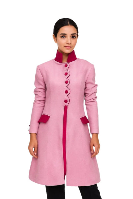 Pink coat with red accents worn by a model on a white background