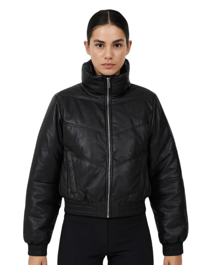 Person wearing a black leather bomber jacket on a white background